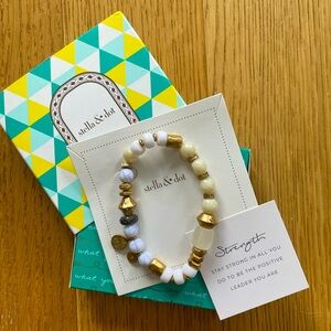 Stella & Dot bracelet for Strength, with color combination of whites & golds.